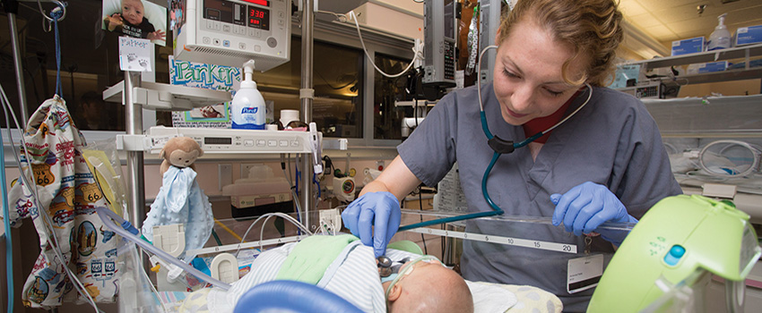 Nurse working with baby